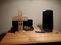 Amazing Grace cross shown with some everyday items